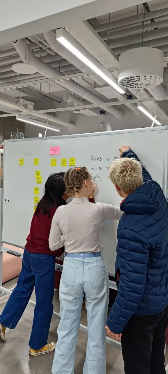 Picture of the team from Junction ideating with a whiteboard