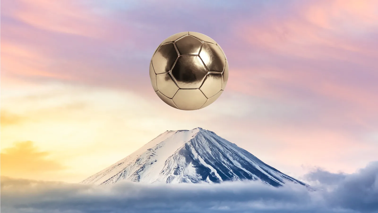 A picture of a golden soccerball above mountain Fuji symbolizing the rise of soccer as a sport